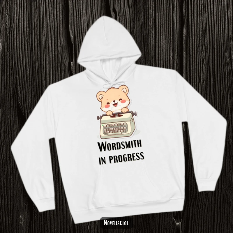 Funny hoodie featuring a content fuzzy animal character happily typing on a vintage typewriter, embodying cozy creativity.