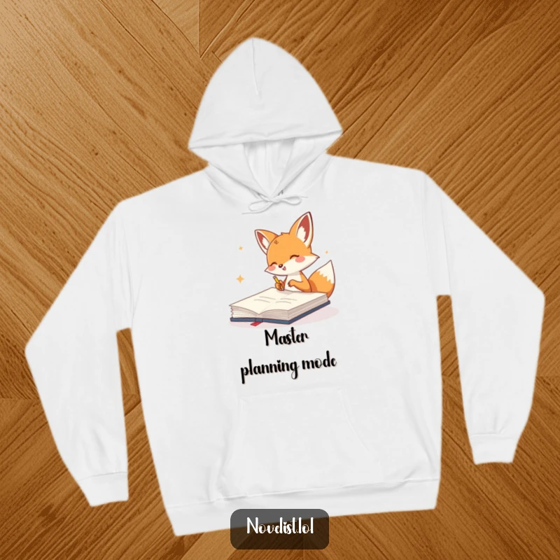 Funny Hoodie showcasing a cute fox gleefully scribbling in a giant notebook, perfect for creative minds and cozy comfort.