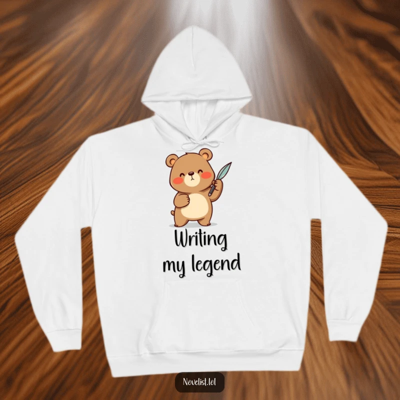 Funny Hoodie: Features a cheerful bear character dramatically gesturing with a quill pen, offering warmth and a humorous take on creative passion.