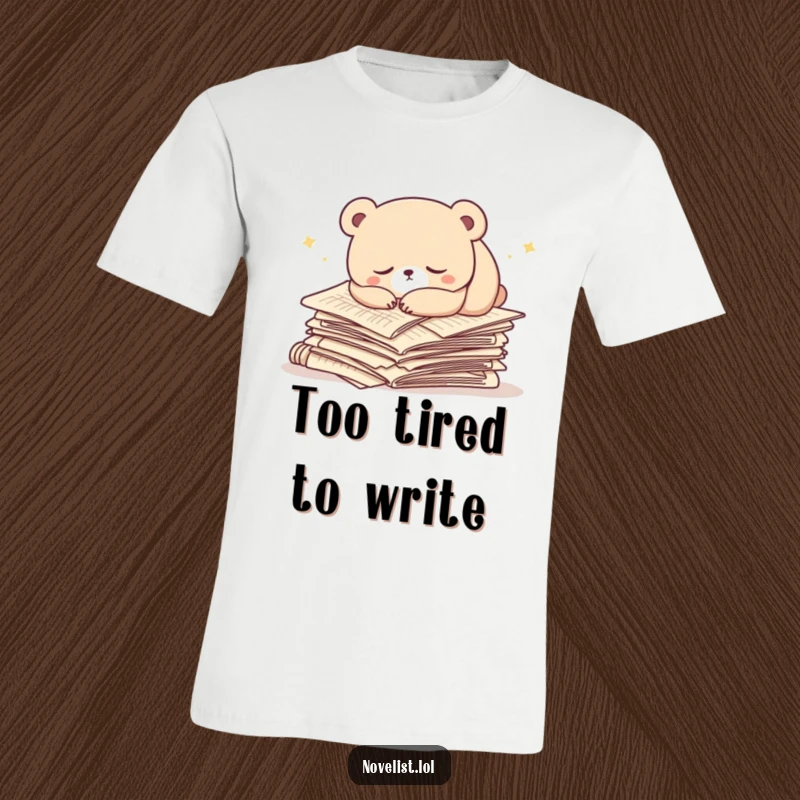 Funny t-shirt featuring a sleepy bear curled up and napping on a huge stack of manuscript papers. A humorous and cozy graphic.